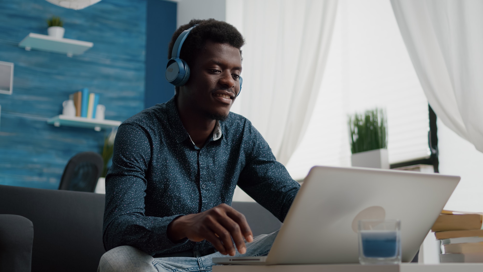 african-american-man-with-headphone-on-watching-movie-on-streaming-services.jpg